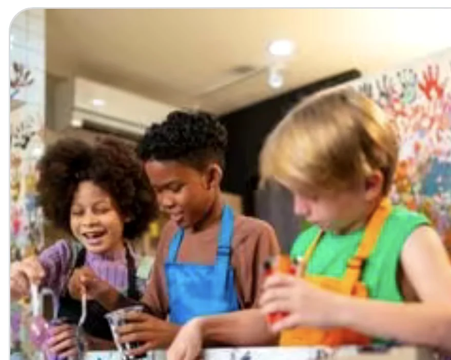 Children experimenting together during a colorful hands-on activity